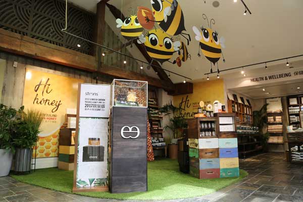 Display of hanging bees promoting NZ made honey products at DFS