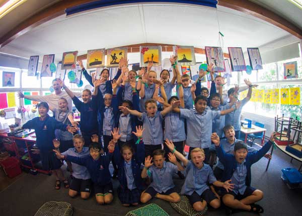 Kids cheering in classroom