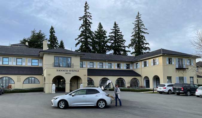 Putting luggage in the car at Hanmer Springs Hotel.