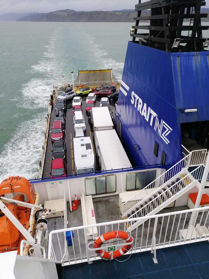 View from top deck of Bluebridge ferry with cars on board.