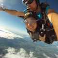 A woman enjoying skydiving in the Bay of Islands.
