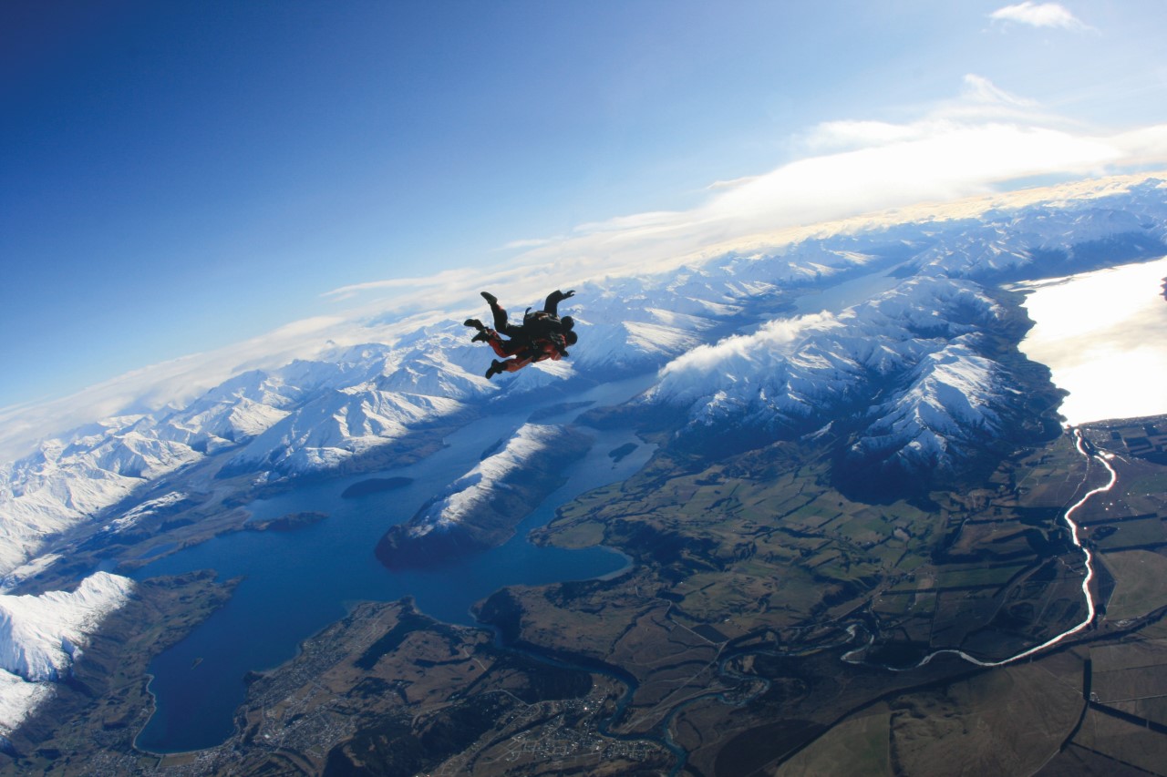 A skydiver taking in breathtaking views over Wanaka